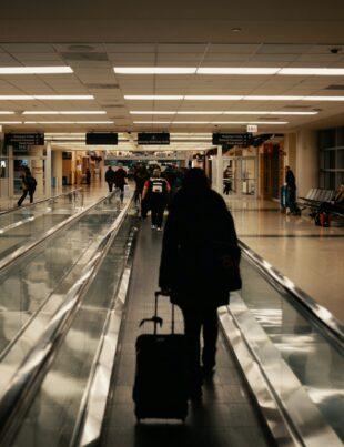 walking man holding luggage