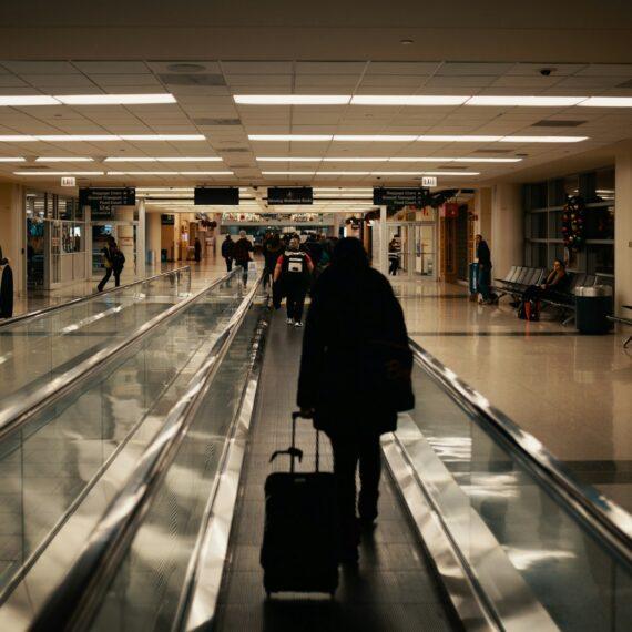 walking man holding luggage