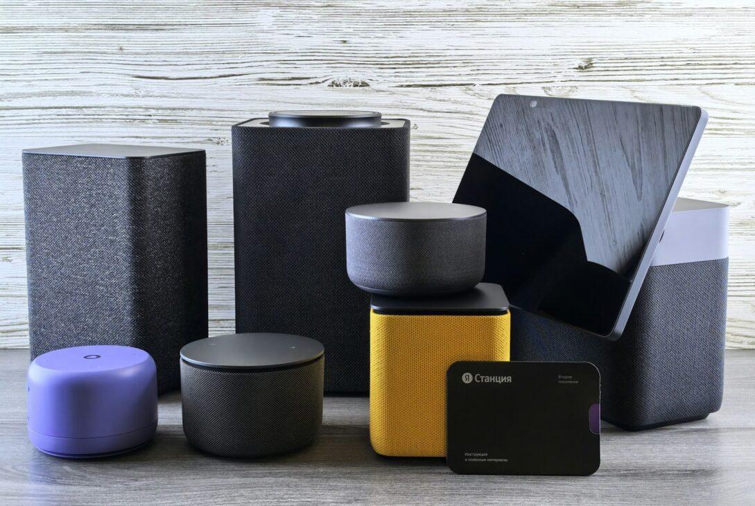 Collection of modern electronic devices and speakers.