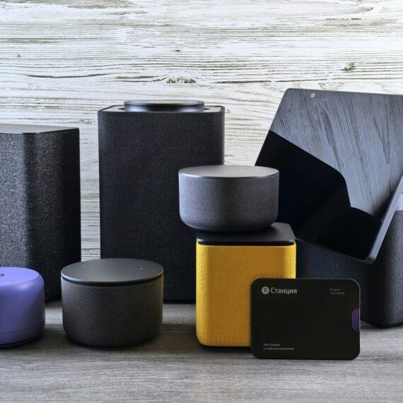 Collection of modern electronic devices and speakers.