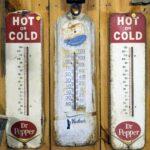 3 clear glass bottles on brown wooden shelf