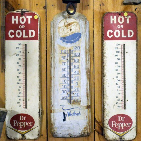 3 clear glass bottles on brown wooden shelf