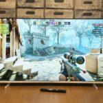 Television screen displaying a first-person shooter video game.