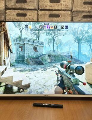 Television screen displaying a first-person shooter video game.