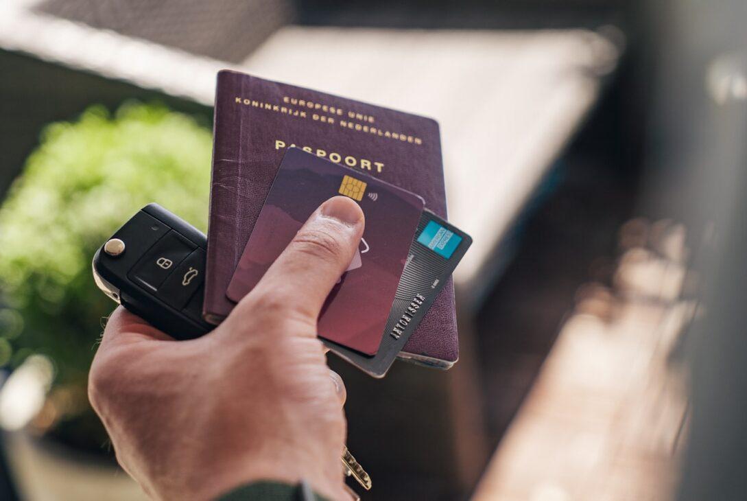 person holding black and brown book
