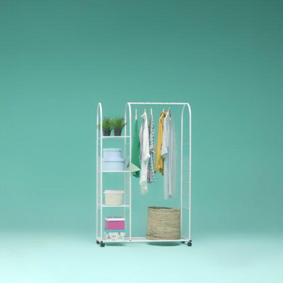 a rack with clothes and a hat on it