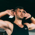 Man doing a core workout with hands behind his head.