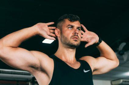 Man doing a core workout with hands behind his head.