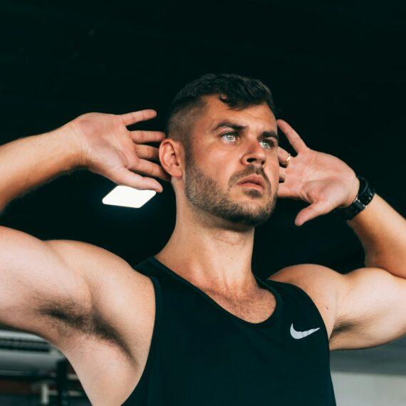Man doing a core workout with hands behind his head.