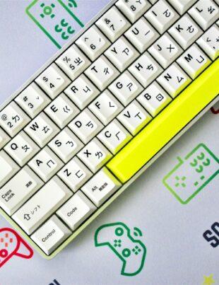 yellow and white keyboard on blue and white surface