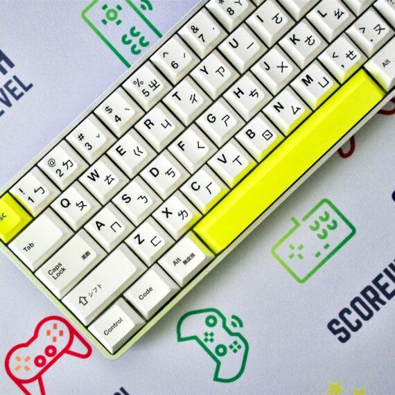 yellow and white keyboard on blue and white surface